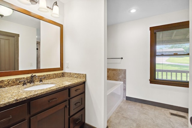 100 Acree Ln, Estill Springs, TN 37330 - full bath with vanity, baseboards, and a bath