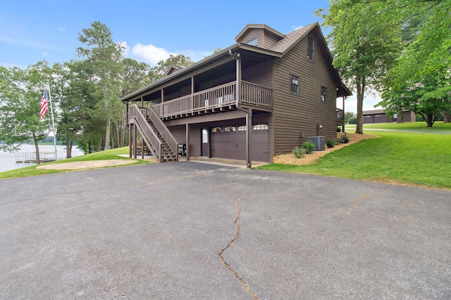 100 Acree Ln, Estill Springs, TN 37330 - view of front of property featuring a front yard, asphalt driveway, cooling unit, and stairway