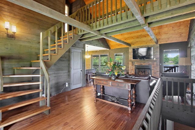 100 Acree Ln, Estill Springs, TN 37330 - living area featuring stairway, wood walls, wood finished floors, and an outdoor stone fireplace