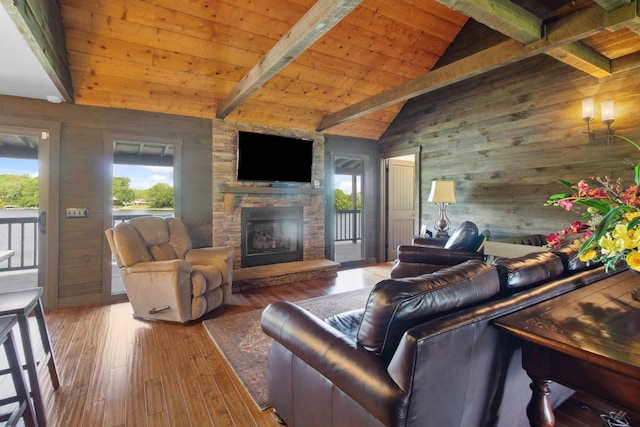 100 Acree Ln, Estill Springs, TN 37330 - living room featuring wooden walls, hardwood / wood-style floors, wood ceiling, and a stone fireplace