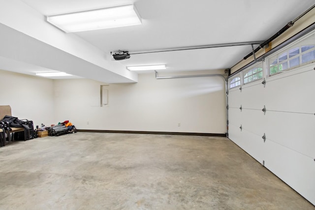 100 Acree Ln, Estill Springs, TN 37330 - garage featuring a garage door opener and baseboards