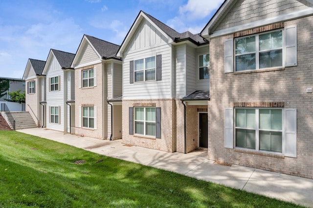 923 SE Broad St Unit A4, Murfreesboro, TN 37130 - townhome / multi-family property featuring brick siding, board and batten siding, and a front lawn