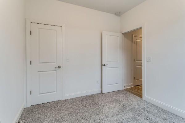 923 SE Broad St Unit A4, Murfreesboro, TN 37130 - unfurnished bedroom with carpet flooring and baseboards