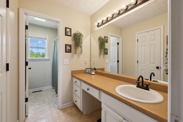 8635 Pleasant Hill Rd, Cross Plains, TN 37049 - bathroom featuring vanity, baseboards, and tile patterned flooring