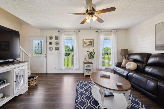 8635 Pleasant Hill Rd, Cross Plains, TN 37049 - living area featuring dark wood-style floors, a textured ceiling, ceiling fan, and stairs