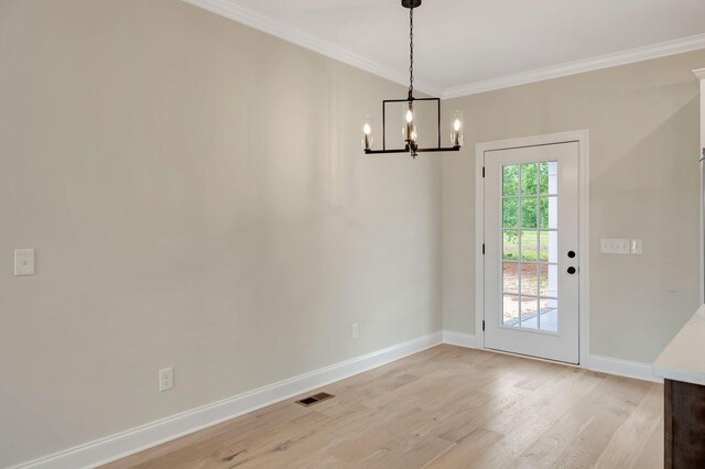 2125 Halls Mill Rd, Unionville, TN 37180 - unfurnished dining area with light wood-style floors, a chandelier, baseboards, and ornamental molding
