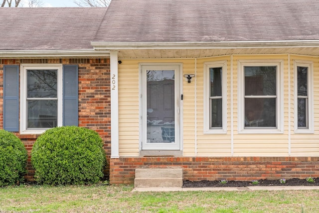 202 Jim Thorpe Dr, Clarksville, TN 37042 - view of exterior entry featuring brick siding and a shingled roof