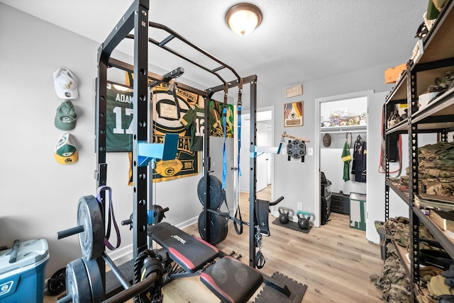 202 Jim Thorpe Dr, Clarksville, TN 37042 - workout area with wood finished floors and a textured ceiling
