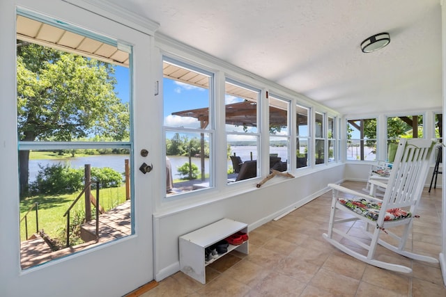 1090 Eva Harbor Rd, Eva, TN 38333 - sunroom featuring a water view, baseboards, and tile patterned floors
