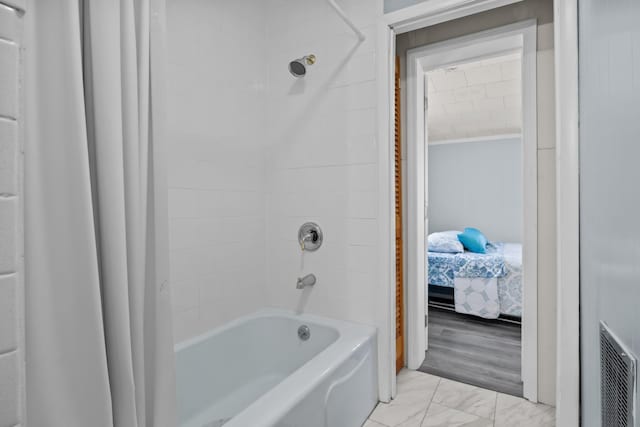 1090 Eva Harbor Rd, Eva, TN 38333 - ensuite bathroom featuring shower / tub combo with curtain and marble finish flooring