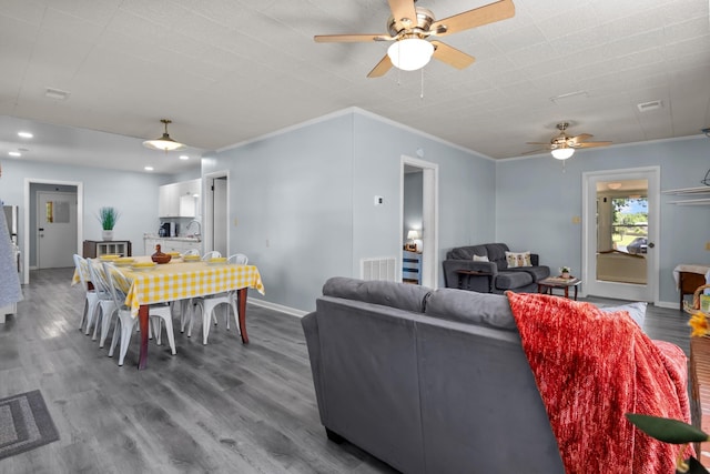 1090 Eva Harbor Rd, Eva, TN 38333 - living area featuring a ceiling fan, wood finished floors, baseboards, ornamental molding, and recessed lighting