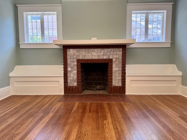 425 Arlington Ave, Jackson, TN 38301 - unfurnished living room featuring wood finished floors and a fireplace