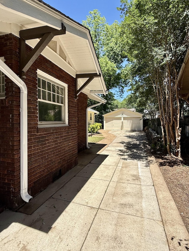 425 Arlington Ave, Jackson, TN 38301 - view of home's exterior featuring brick siding and an outdoor structure