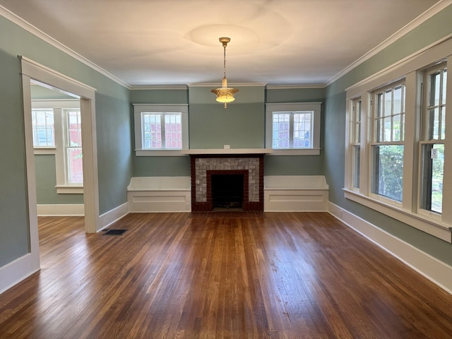 425 Arlington Ave, Jackson, TN 38301 - unfurnished living room with dark wood-style floors, baseboards, a brick fireplace, and crown molding