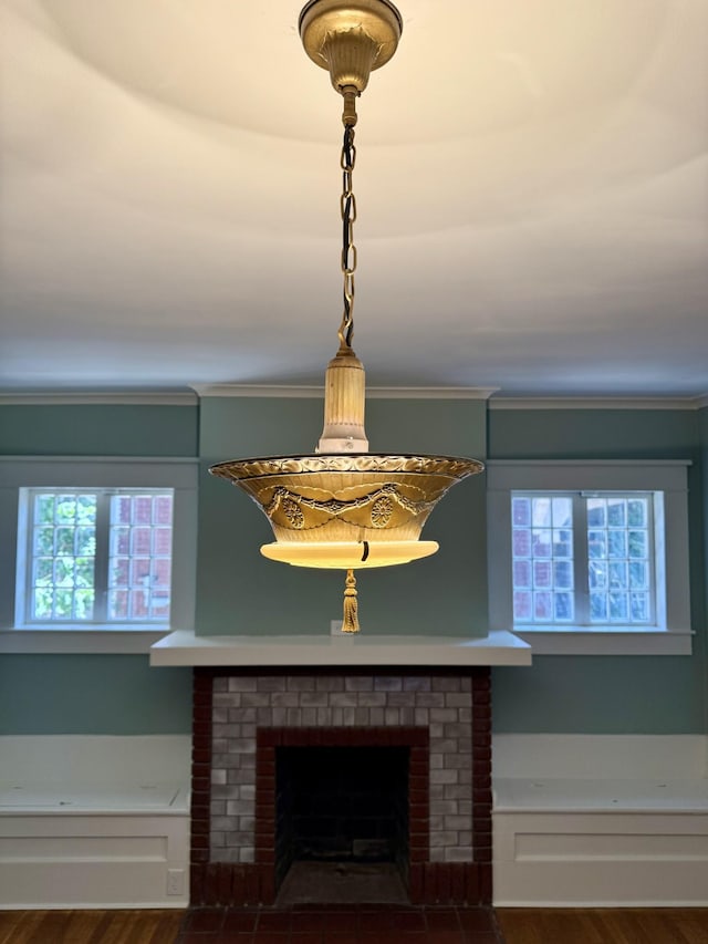 425 Arlington Ave, Jackson, TN 38301 - detailed view of a brick fireplace, wood finished floors, and ornamental molding