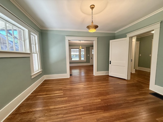 425 Arlington Ave, Jackson, TN 38301 - unfurnished dining area featuring baseboards, wood finished floors, and ornamental molding