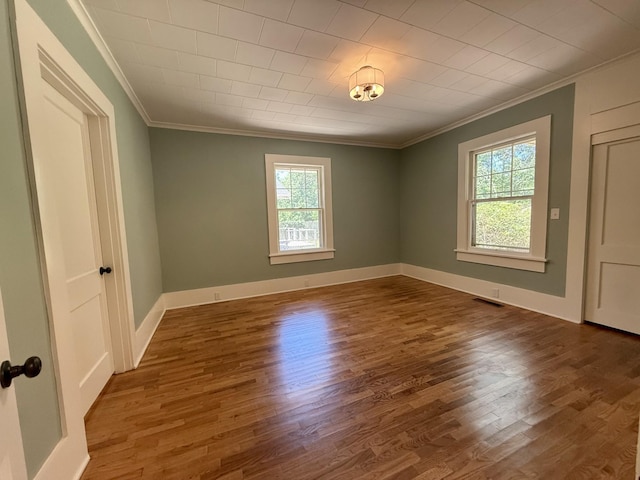425 Arlington Ave, Jackson, TN 38301 - unfurnished room featuring ornamental molding, wood finished floors, and baseboards