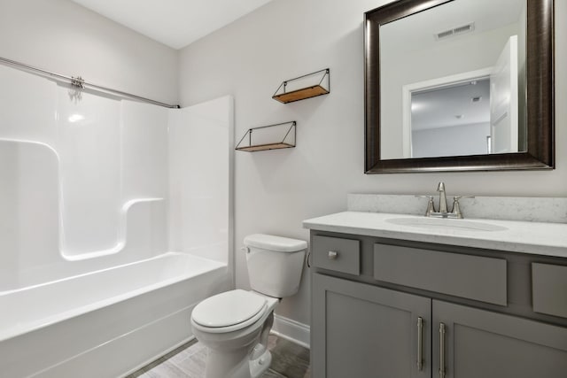 229 Claremont Ct, Gallatin, TN 37066 - bathroom featuring toilet, vanity, bathing tub / shower combination, baseboards, and wood finished floors