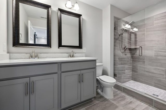 229 Claremont Ct, Gallatin, TN 37066 - full bathroom featuring double vanity, toilet, and a shower stall