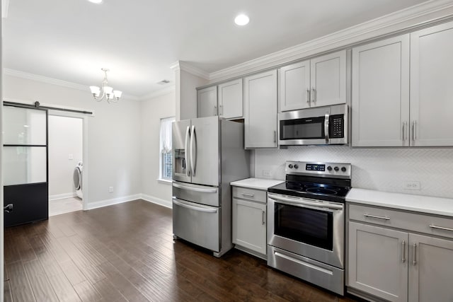 229 Claremont Ct, Gallatin, TN 37066 - kitchen with gray cabinetry, stainless steel appliances, washer / dryer, a chandelier, and light countertops
