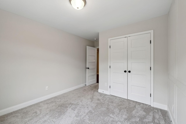 229 Claremont Ct, Gallatin, TN 37066 - unfurnished bedroom with carpet flooring, a closet, and baseboards