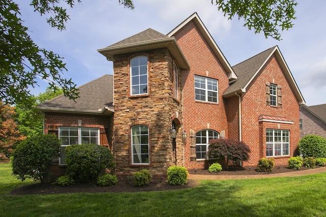 2732 Avington Ct, Murfreesboro, TN 37128 - view of front of home with a shingled roof, a front lawn, brick siding, and stone siding