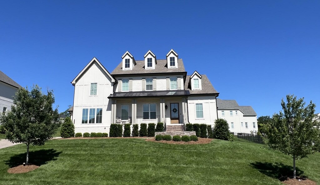 235 Belgian Rd, Nolensville, TN 37135 - view of front facade featuring a front lawn, a standing seam roof, and metal roof