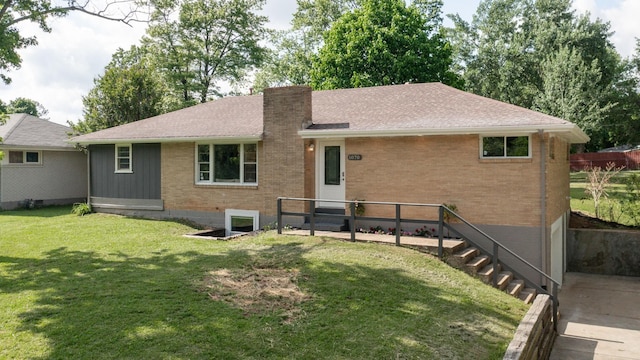 1070 Draughon Dr, Greenbrier, TN 37073 - rear view of property featuring brick siding, a yard, a chimney, and roof with shingles