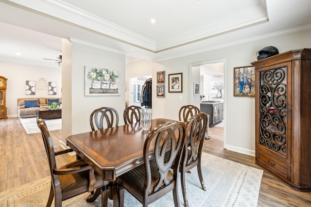 803 Bradford Pl, Murfreesboro, TN 37130 - dining space featuring wood finished floors, crown molding, baseboards, a raised ceiling, and recessed lighting