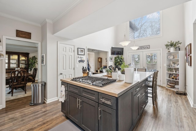 803 Bradford Pl, Murfreesboro, TN 37130 - kitchen featuring butcher block countertops, stainless steel gas stovetop, dark wood finished floors, french doors, and ornamental molding