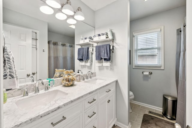 803 Bradford Pl, Murfreesboro, TN 37130 - bathroom with toilet, double vanity, baseboards, tile patterned floors, and a shower with curtain