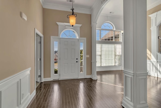 499 Williamsport Dr, Smyrna, TN 37167 - entryway with decorative columns, dark wood-style flooring, crown molding, a high ceiling, and arched walkways