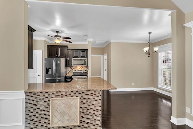 499 Williamsport Dr, Smyrna, TN 37167 - kitchen with stainless steel appliances, backsplash, ceiling fan, a chandelier, and light stone countertops