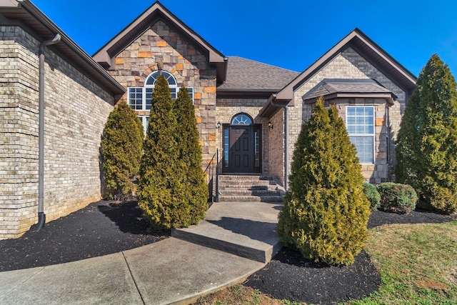 499 Williamsport Dr, Smyrna, TN 37167 - doorway to property featuring brick siding and a shingled roof