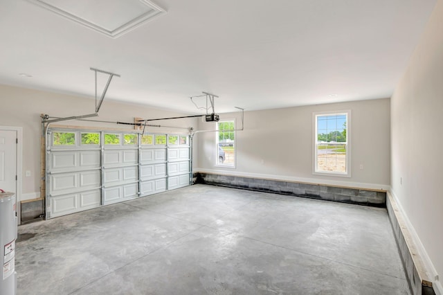 2121 Halls Mill Rd, Unionville, TN 37180 - garage with a garage door opener, baseboards, and water heater