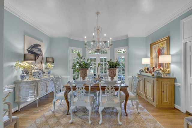 216 Chestnut Hill Dr, Nashville, TN 37215 - dining room featuring a chandelier, light wood-type flooring, ornamental molding, and baseboards