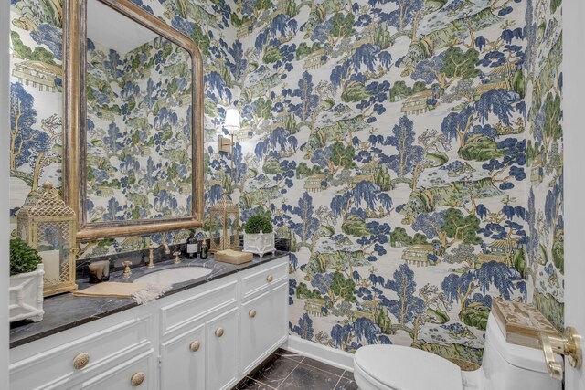 216 Chestnut Hill Dr, Nashville, TN 37215 - bathroom featuring toilet, wallpapered walls, vanity, marble finish floors, and baseboards