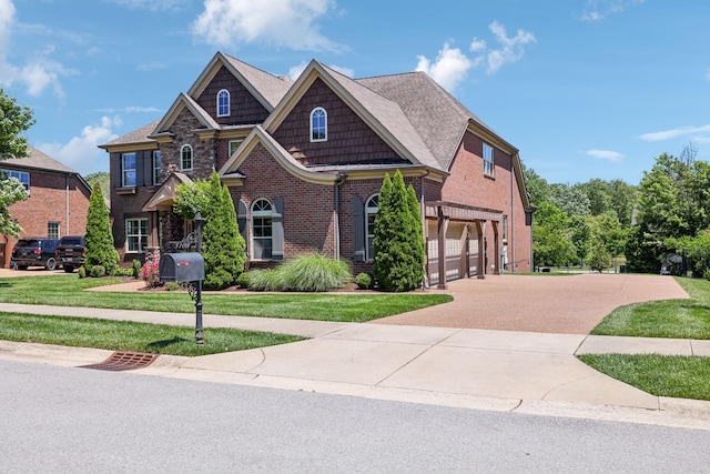 5108 Duckhorn Ct, Franklin, TN 37067 - craftsman inspired home with a garage, concrete driveway, brick siding, and a front lawn
