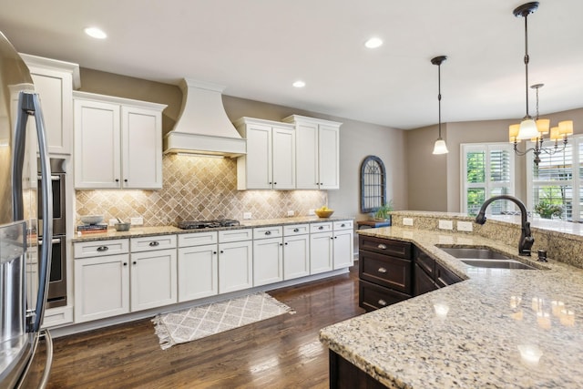 5108 Duckhorn Ct, Franklin, TN 37067 - kitchen featuring a sink, custom range hood, stainless steel appliances, white cabinets, and recessed lighting