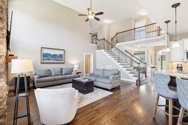 5108 Duckhorn Ct, Franklin, TN 37067 - living area featuring a high ceiling, stairs, dark wood-style floors, ceiling fan, and baseboards