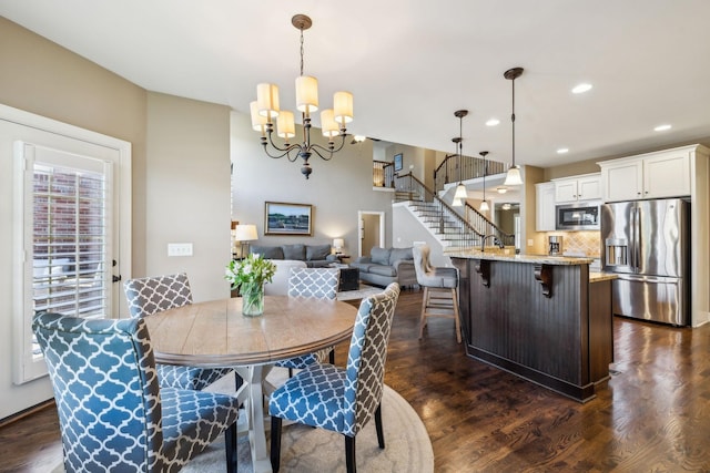 5108 Duckhorn Ct, Franklin, TN 37067 - dining space with stairway, a chandelier, dark wood-style flooring, and recessed lighting