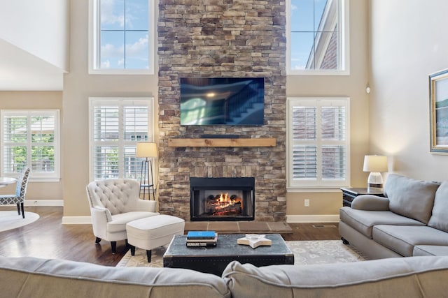 5108 Duckhorn Ct, Franklin, TN 37067 - living room with wood finished floors, a fireplace, baseboards, and a high ceiling