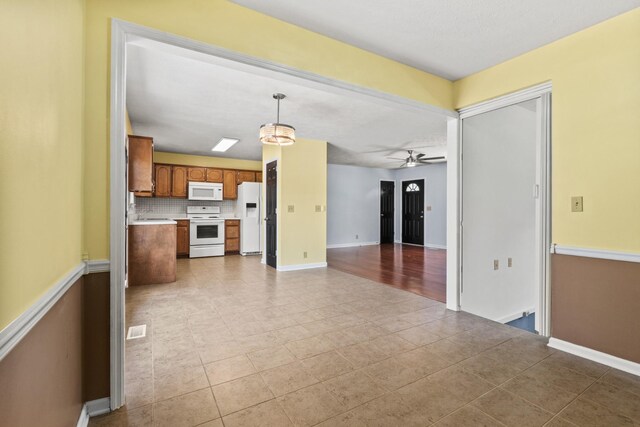 4008 Michelle St, Murfreesboro, TN 37128 - unfurnished living room featuring tile patterned flooring, baseboards, and ceiling fan