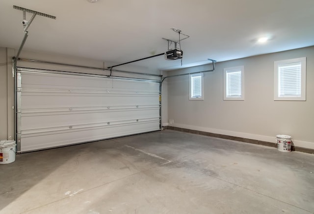 2021 Beech Ave Unit 5, Nashville, TN 37204 - garage featuring a garage door opener and baseboards