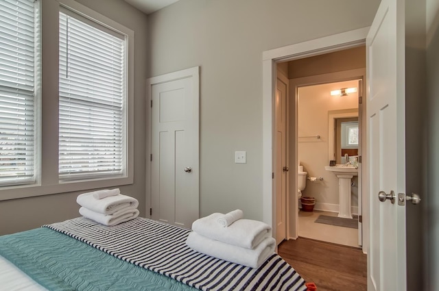 2021 Beech Ave Unit 5, Nashville, TN 37204 - bedroom with dark wood-style floors, ensuite bathroom, and a sink