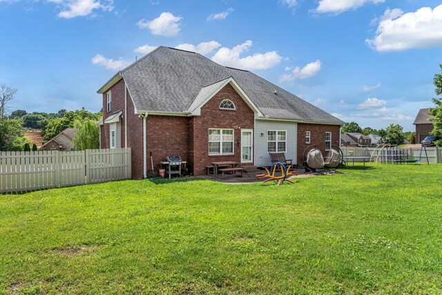 201 Abbey Rd, Lebanon, TN 37090 - back of house featuring brick siding, a fenced backyard, a shingled roof, and a patio