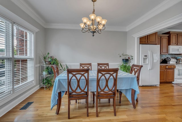 201 Abbey Rd, Lebanon, TN 37090 - dining area featuring a chandelier, light wood-type flooring, and ornamental molding