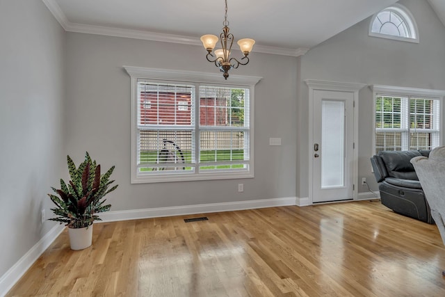 201 Abbey Rd, Lebanon, TN 37090 - entryway with wood finished floors, a chandelier, ornamental molding, and vaulted ceiling