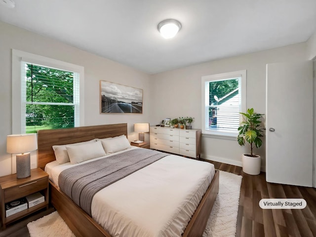 948 Oak St, Lewisburg, TN 37091 - bedroom with multiple windows, wood finished floors, and baseboards