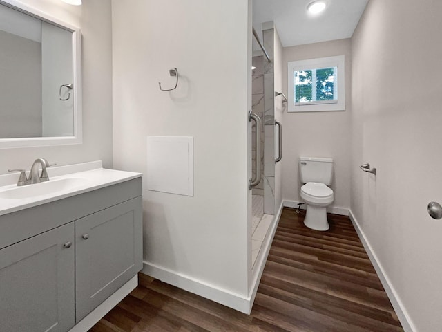 948 Oak St, Lewisburg, TN 37091 - full bath with wood finished floors, baseboards, toilet, a shower stall, and vanity